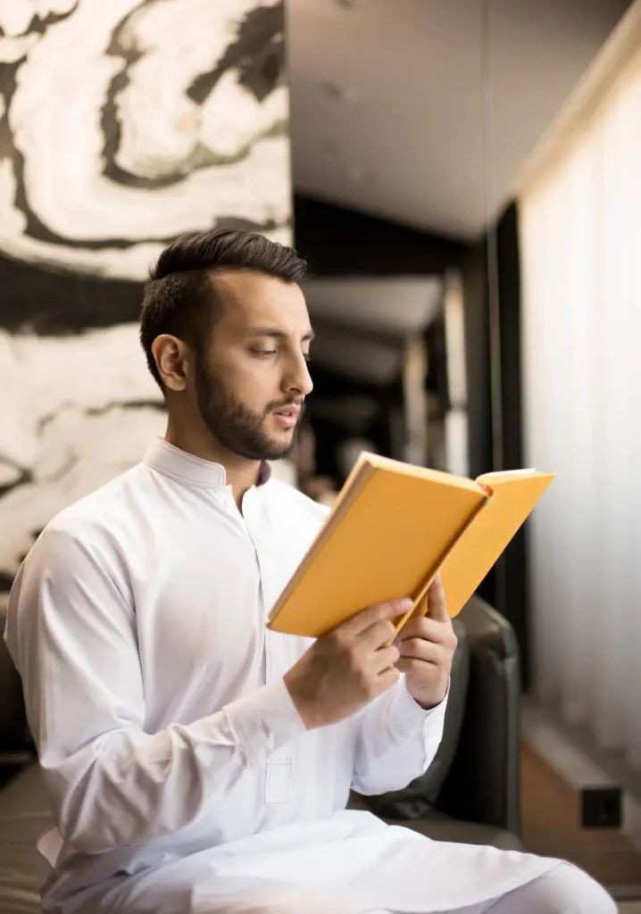 An Adult is Reading the Quran